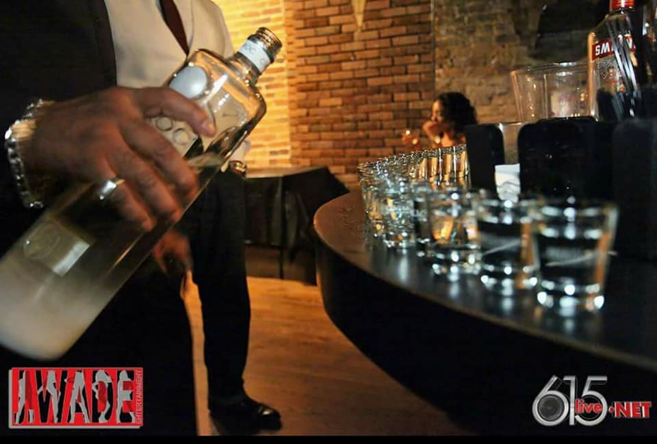 bartender pouring a drink