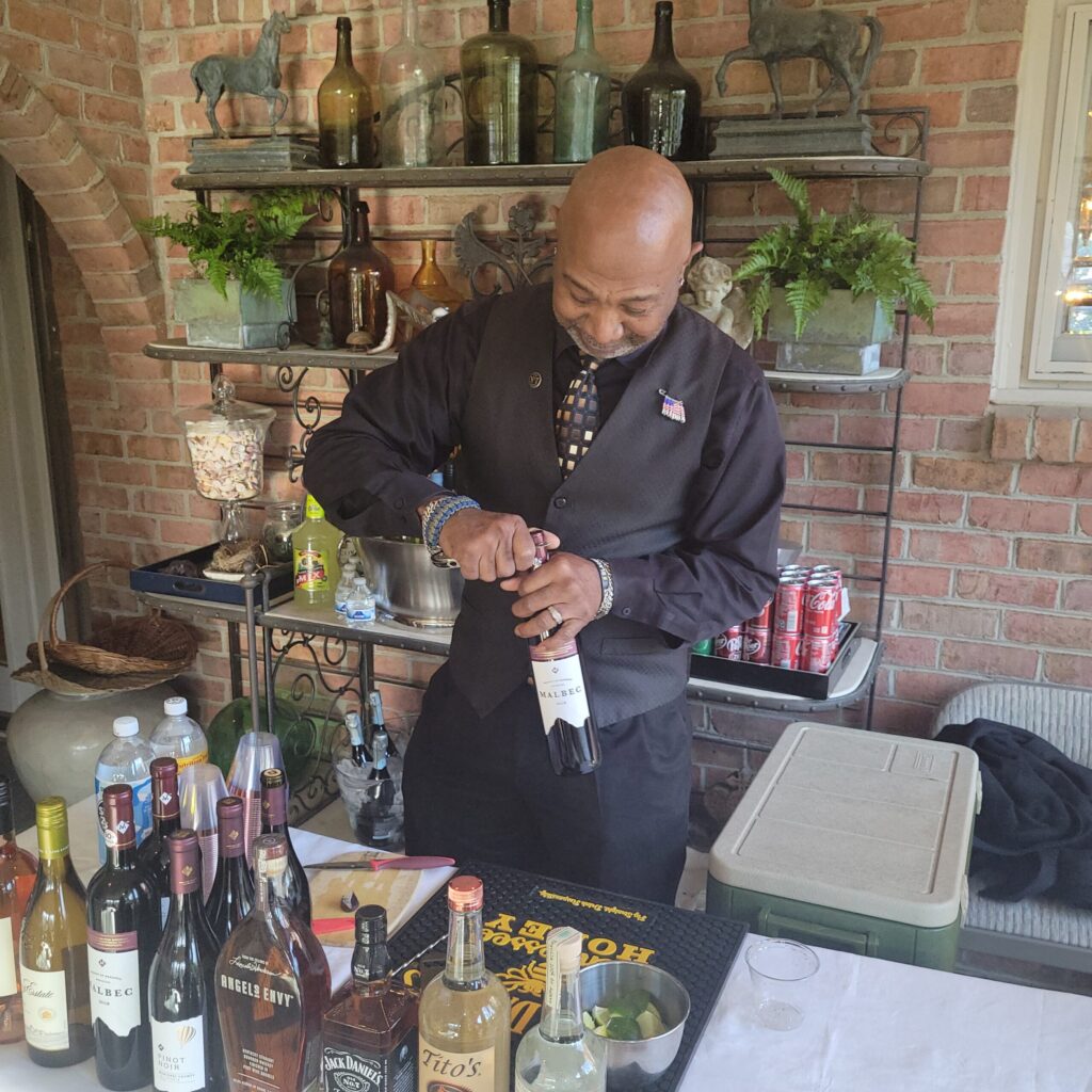 Licensed bartender opening wine bottle
