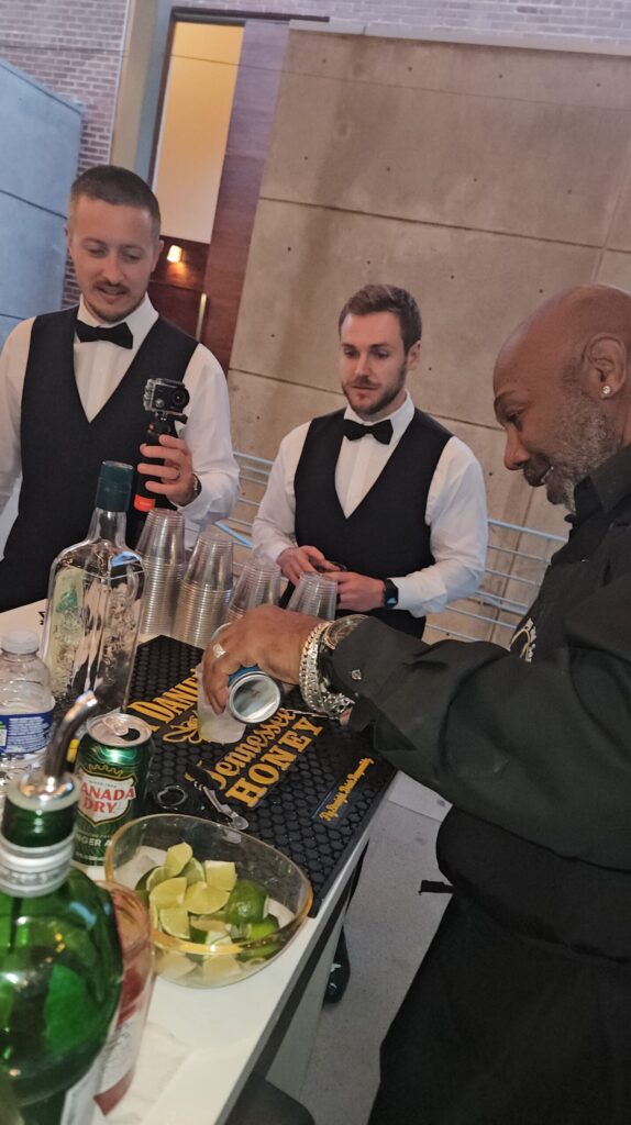 bartenders pouring and serving drinks