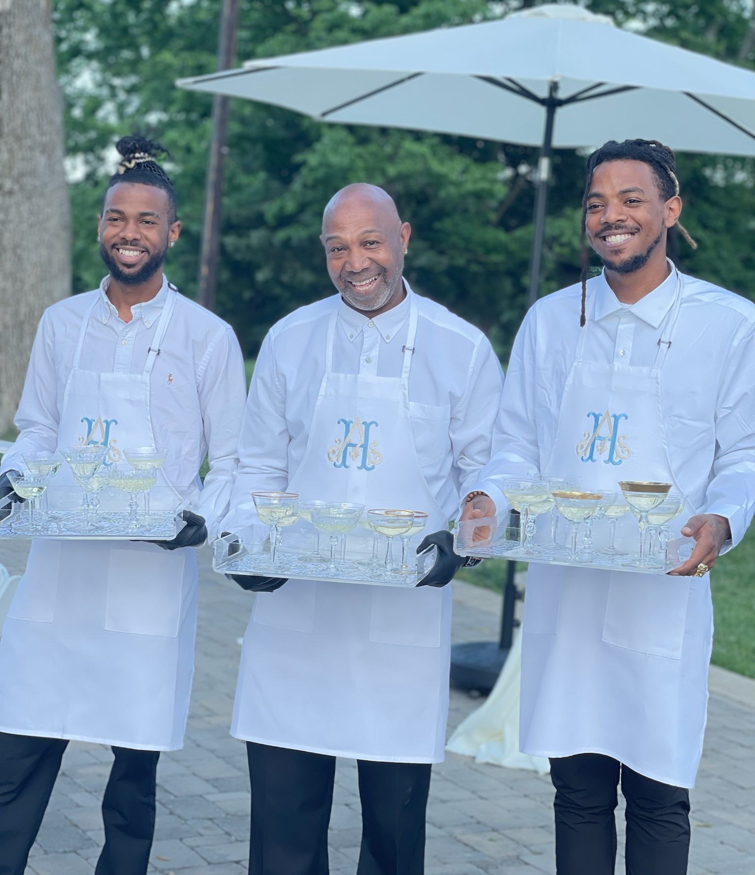 event staff passing cocktails