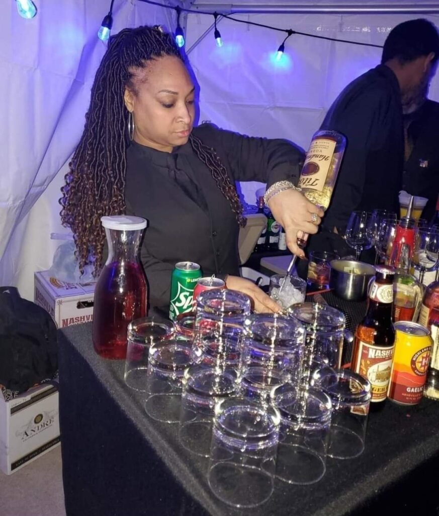 female bartenders pouring drinks